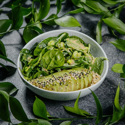 Green salad with avocado and nut sauce